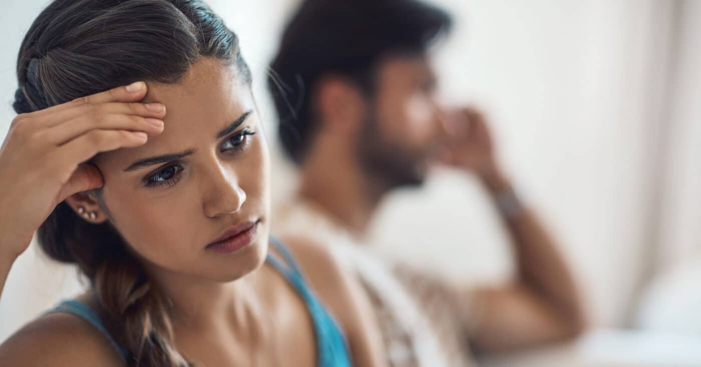 Shot of a young couple having an argument while sitting on their
